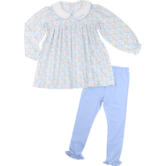 Baby dress and pants set with pumpkin and bow pattern on a white background