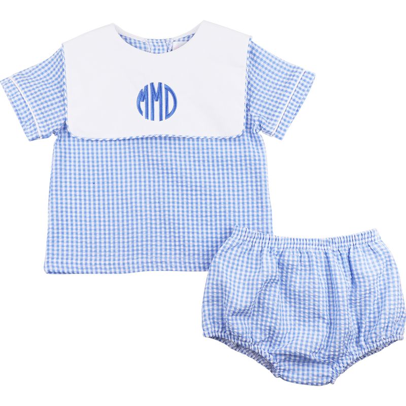 Baby outfit with blue checkered shirt and bloomers on a white background
