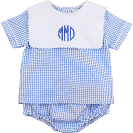 Blue checkered baby outfit with white bib and 'MMD' monogram on a white background