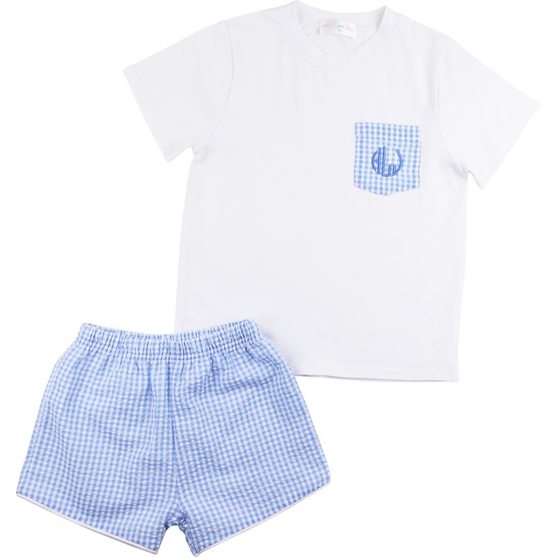 White t-shirt with blue pocket design and blue checkered shorts on a white background