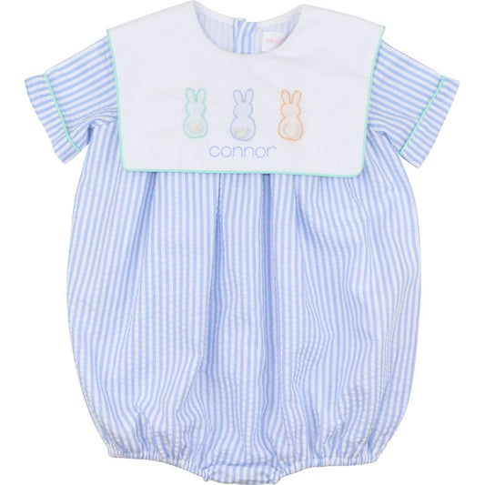 Baby bubble with blue and white striped pattern and embroidered bunnies on a white background