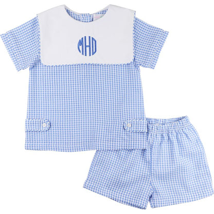 Blue checkered outfit with a monogram on a white background