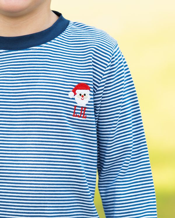 Blue and white striped shirt with a cartoon character on a yellow background