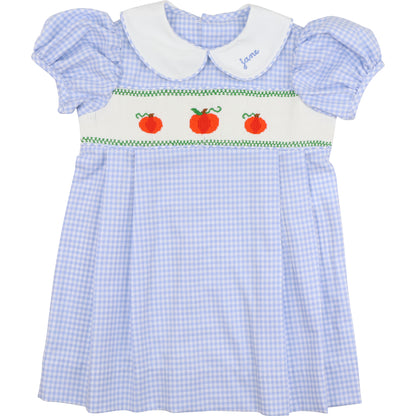 Blue checkered dress with white collar and apple design on a white background