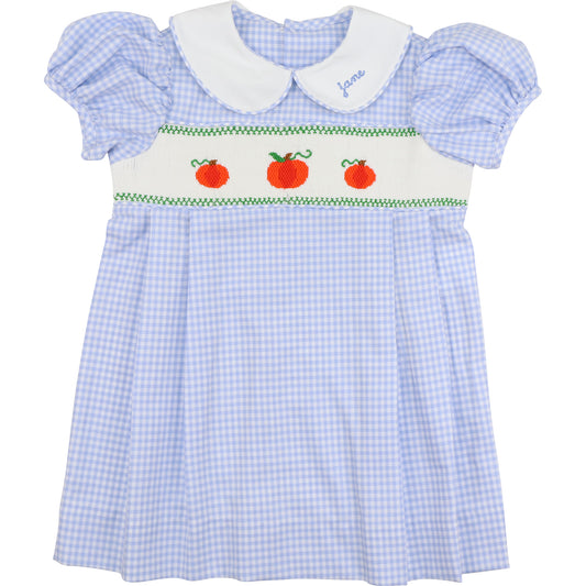 Blue checkered dress with white collar and apple design on a white background