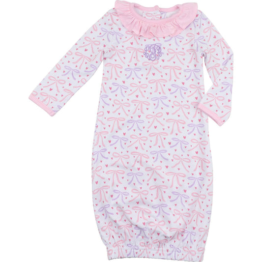 Baby girl bamboo gown with pink and lavender bow print, ruffle collar, elastic hem, and lavender chest monogram, size NB.