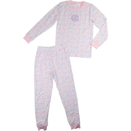 Girls bamboo pajamas, pink and lavender bow print, two-piece long sleeve set with cuffed pants.