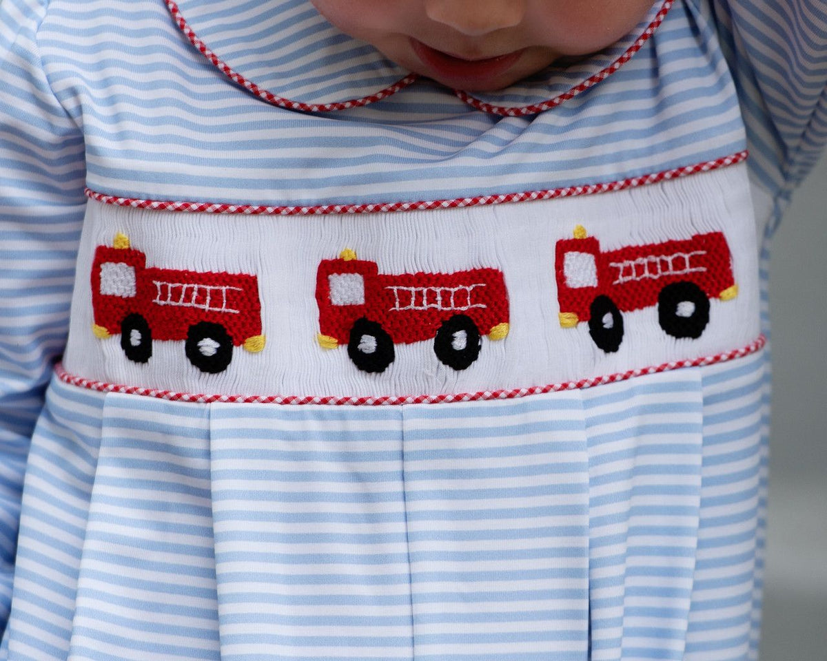 Boys_long_romper_with_red_fire_truck_design_on_a_white_background_1