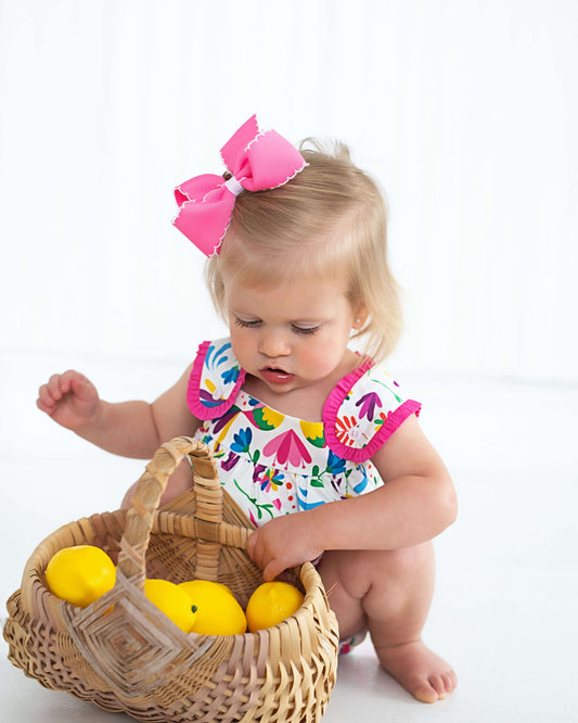 Child playing with a basket of toys on a white background