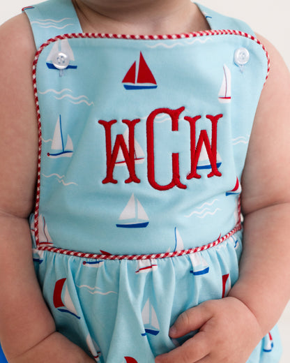 Children's bubble with sailboat pattern and 'WGW' monogram on a light blue background