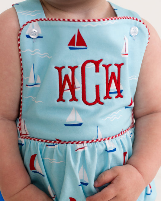 Children's bubble with sailboat pattern and 'WGW' monogram on a light blue background