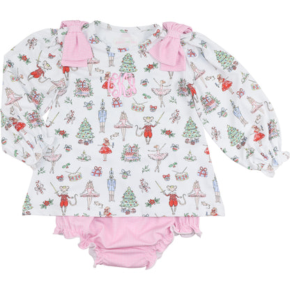 Children's outfit with long-sleeve top and pink bloomers featuring a festive nutcracker pattern on a white background.