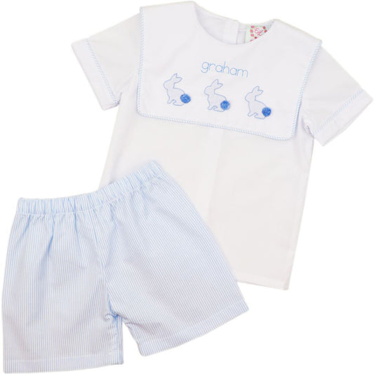 Children's outfit with white shirt and blue shorts on a white background