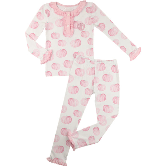 Children's pajama set with pink pumpkin pattern on a white background