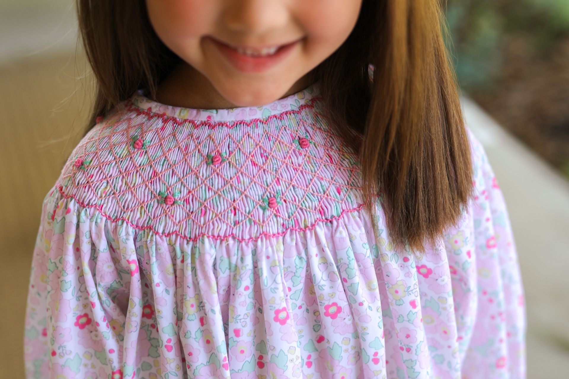 Close up of Pink And Green Floral Smocked Legging Set