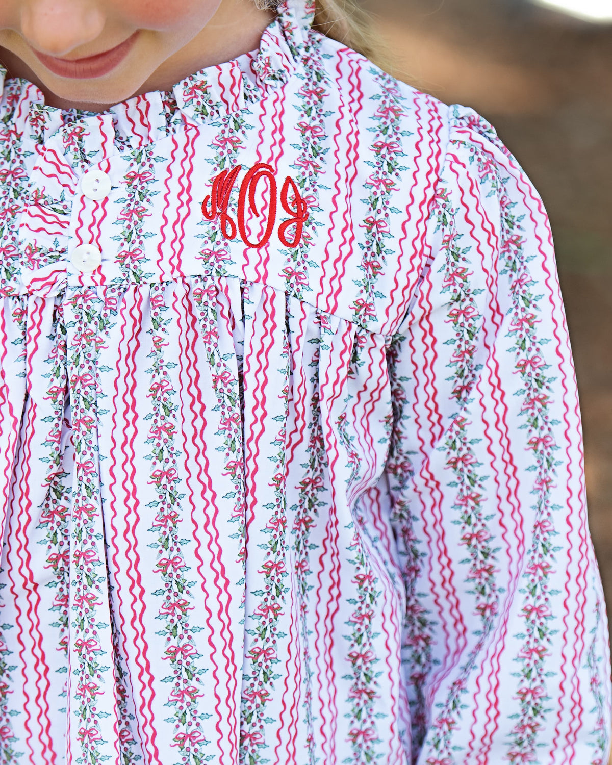 Close up of a monogram on the Red And Green Holiday Garland Nightgown