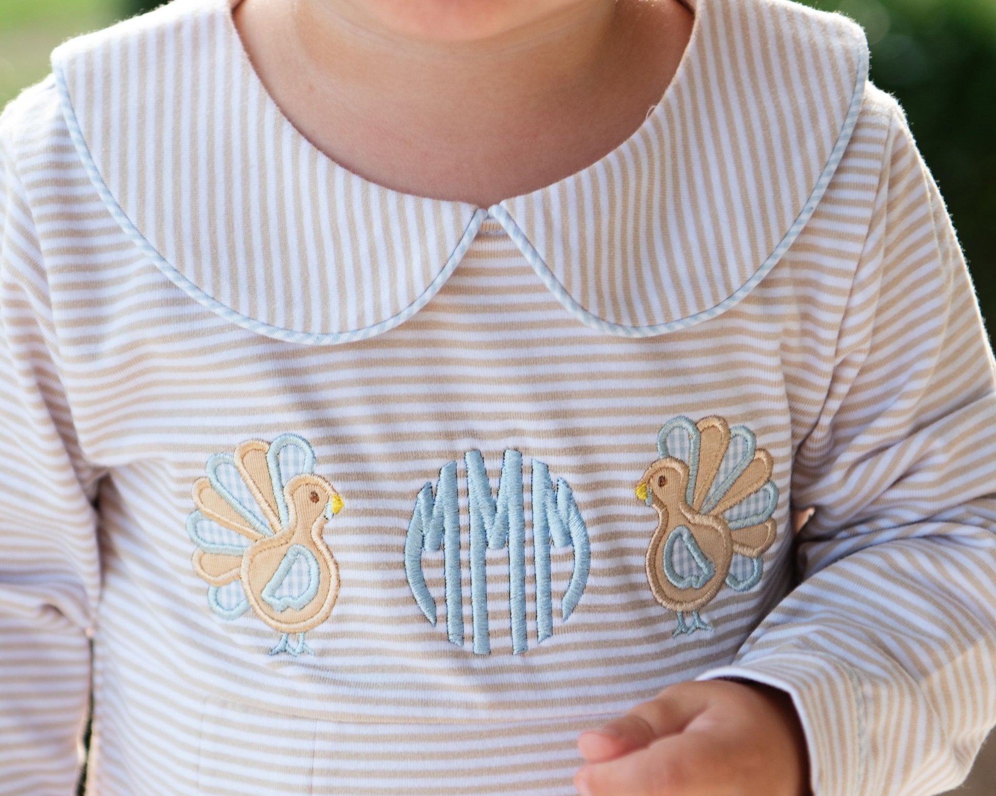 Close up of boys striped bubble with turkeys and monogram "mMm"