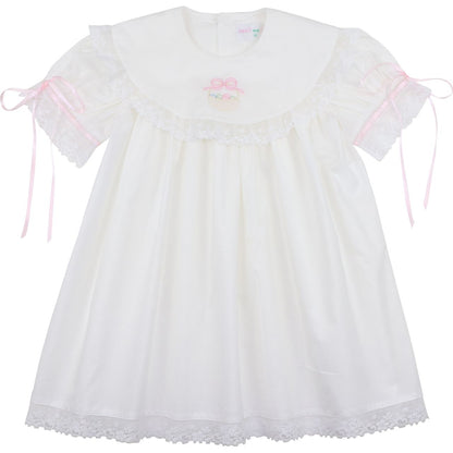 Girls white heirloom dress, embroidered Easter basket with eggs, pink ribbon ties, lace trim, front view
