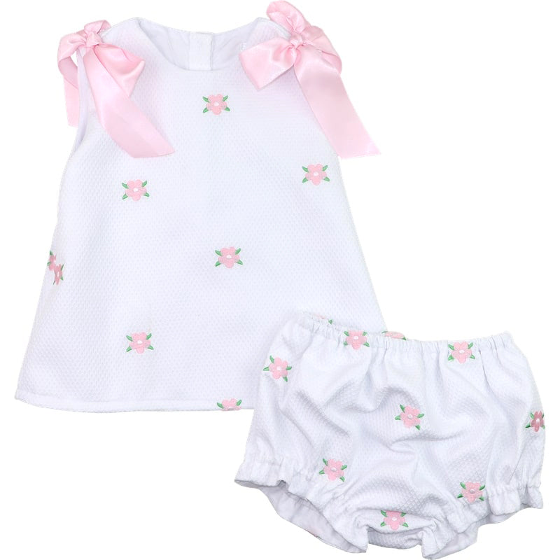 Baby girl's outfit with white top and bloomers featuring pink floral embroidery on a white background.