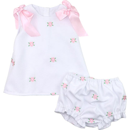 Baby girl's outfit with white top and bloomers featuring pink floral embroidery on a white background.