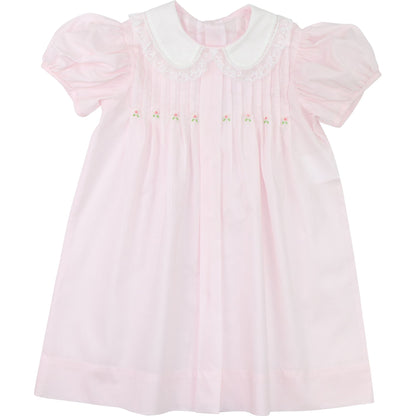Girls pink heirloom dress with white Peter Pan collar, puff sleeves, embroidered rosebuds, flat lay view