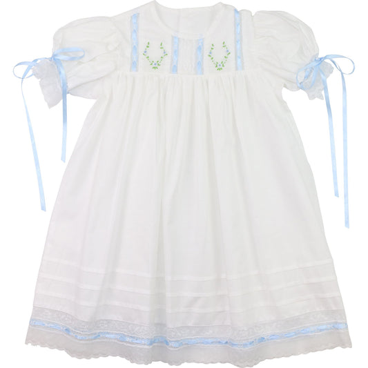 Girls white heirloom dress, embroidered green wreath, blue satin ribbon ties, lace trim, front view