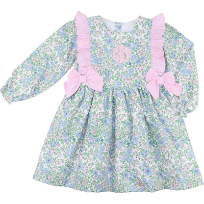 Floral dress with pink bows and ruffle on a white background