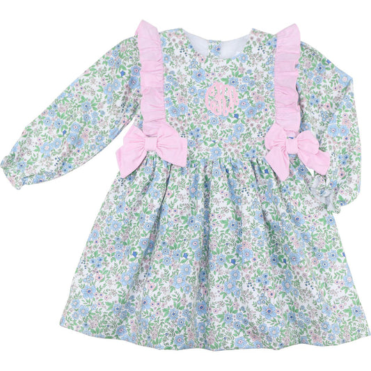 Floral dress with pink bows and ruffle on a white background