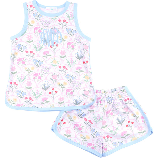 Children's sleeveless top and shorts set with floral pattern on a white background
