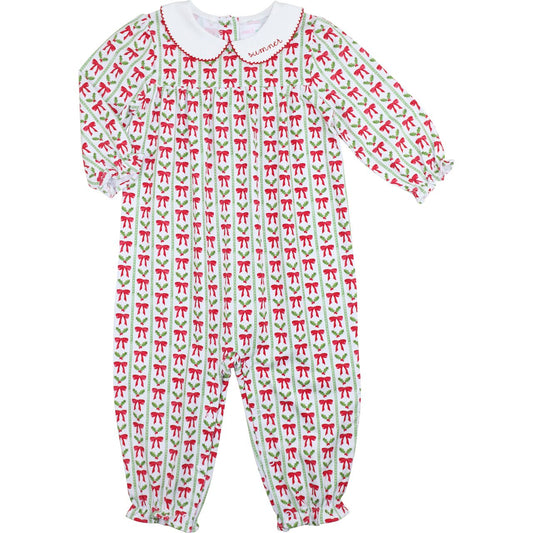 Children's onesie with red and green bow pattern on a white background