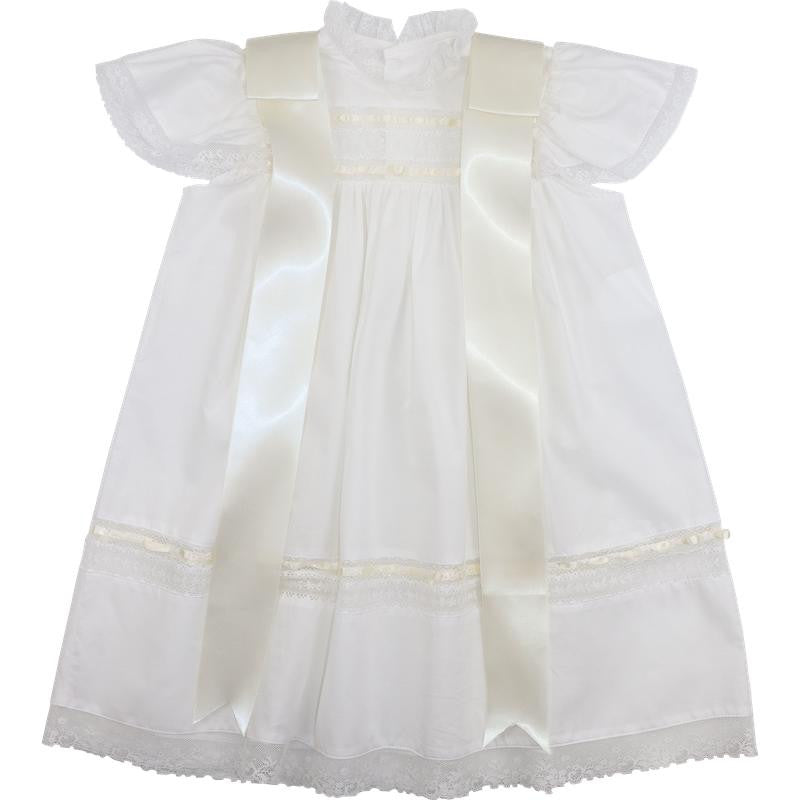 Ivory heirloom dress for girls featuring delicate lace trim, flutter sleeves, and elegant satin bows. A timeless special occasion dress ideal for christenings, blessings, and formal portraits.