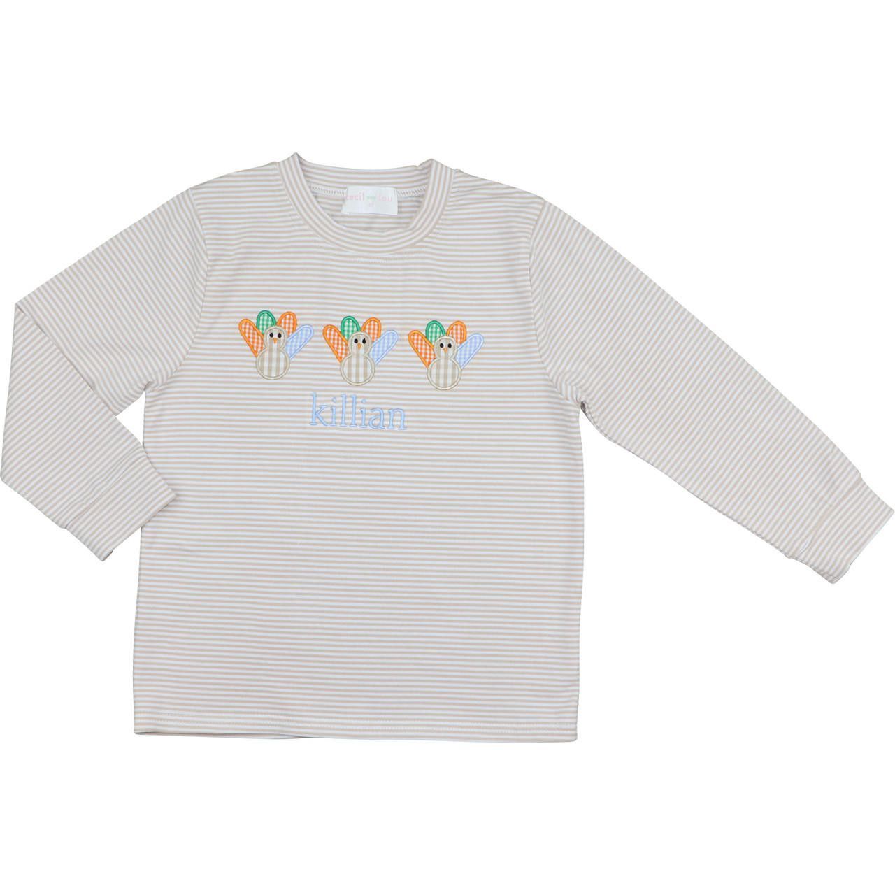 Striped long-sleeve shirt with colorful turkey design and 'killian' monogram on a white background