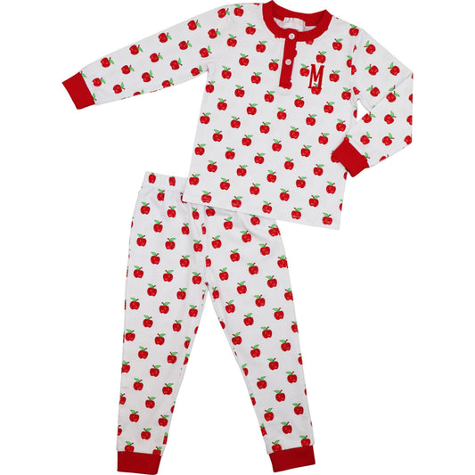 Children's pajama set with red apple pattern on a white background