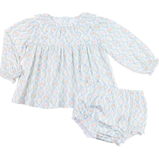 Baby outfit with floral and pumpkin  pattern on a white background