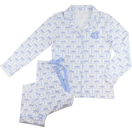 Ladies pajama set with blue bow pattern on a white background