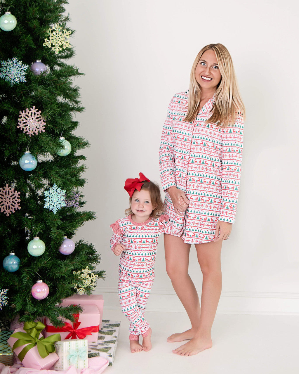 Lady and young girl wearing matching pajamas 