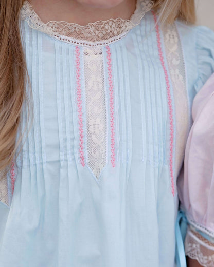 Light blue dress with lace details worn by a person
