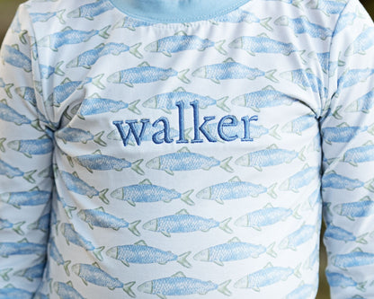 Long-sleeve shirt with fish pattern and 'walker' text on a light blue background