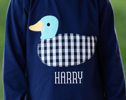 Navy blue shirt with a duck design and 'Harry' text on a green background
