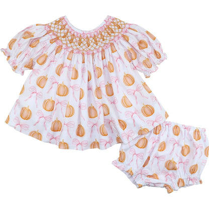 Diaper set featuring pumpkin and bow pattern on a white background
