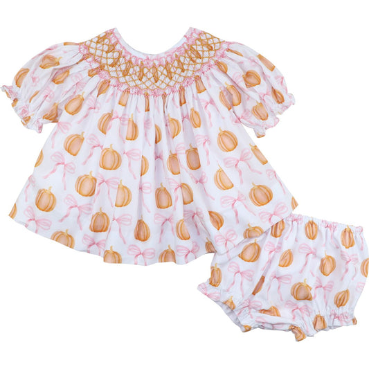 Diaper set featuring pumpkin and bow pattern on a white background