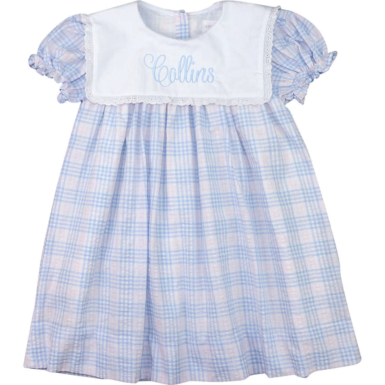 Blue and white checkered dress with 'Collins' embroidery on a white background