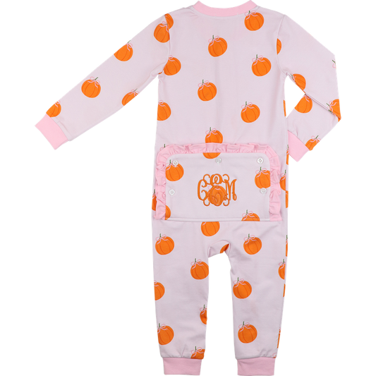 zipper pajama with orange pumpkin pattern on a light pink background