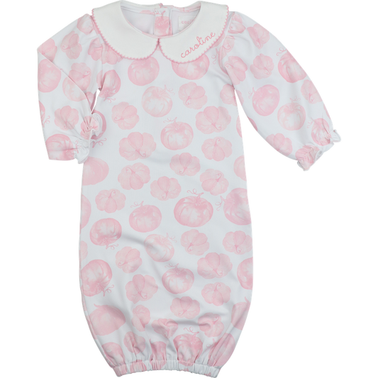 Baby onesie with pink pumpkin pattern on a white background