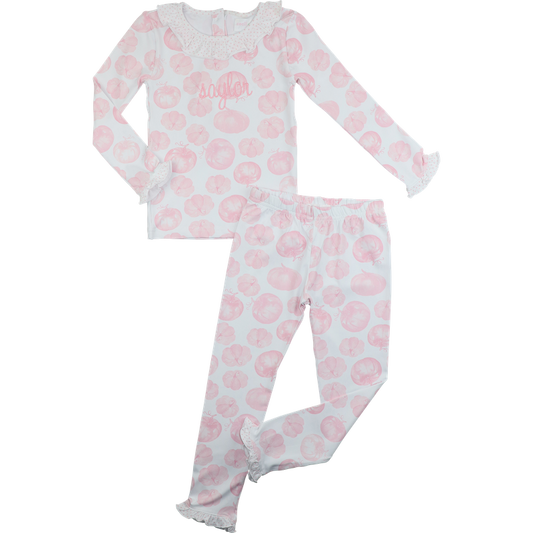 Girl pajama set with pink pumpkin pattern on a white background