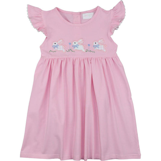Pink dress with embroidered bunnies on a white background