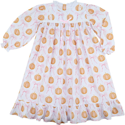 White dress with orange pumpkin pattern on a white background