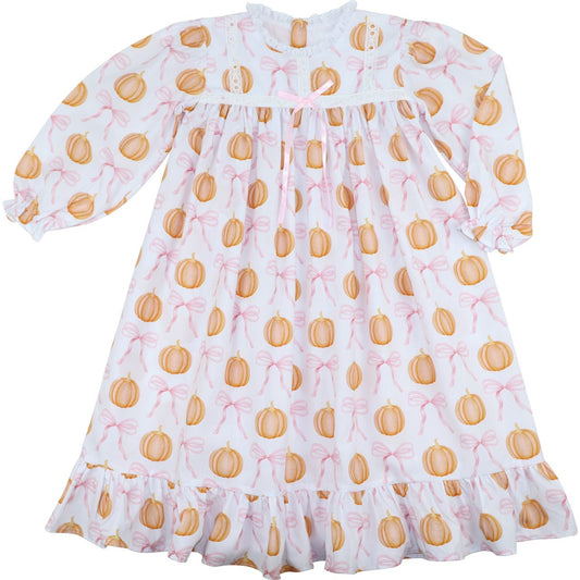 White dress with orange pumpkin pattern on a white background
