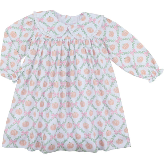 girl dress with pink pumpkin pattern on a white background