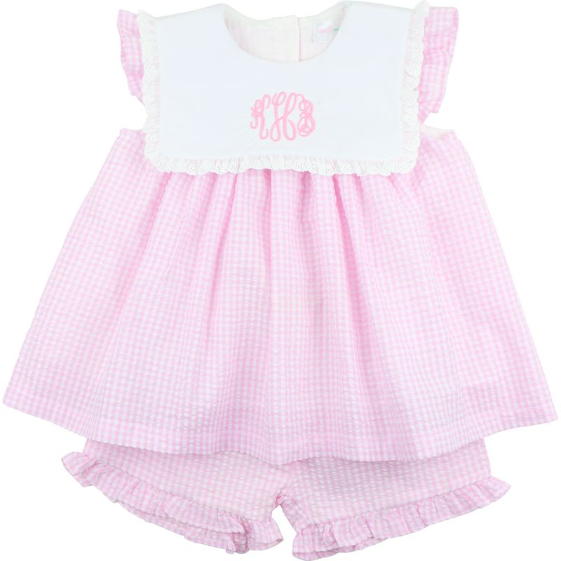 Pink checkered baby outfit with white top on a white background